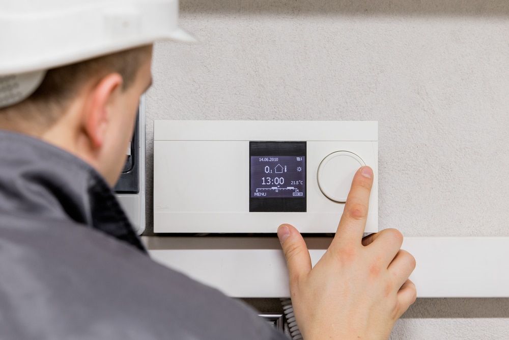 Technician Working on Thermostat