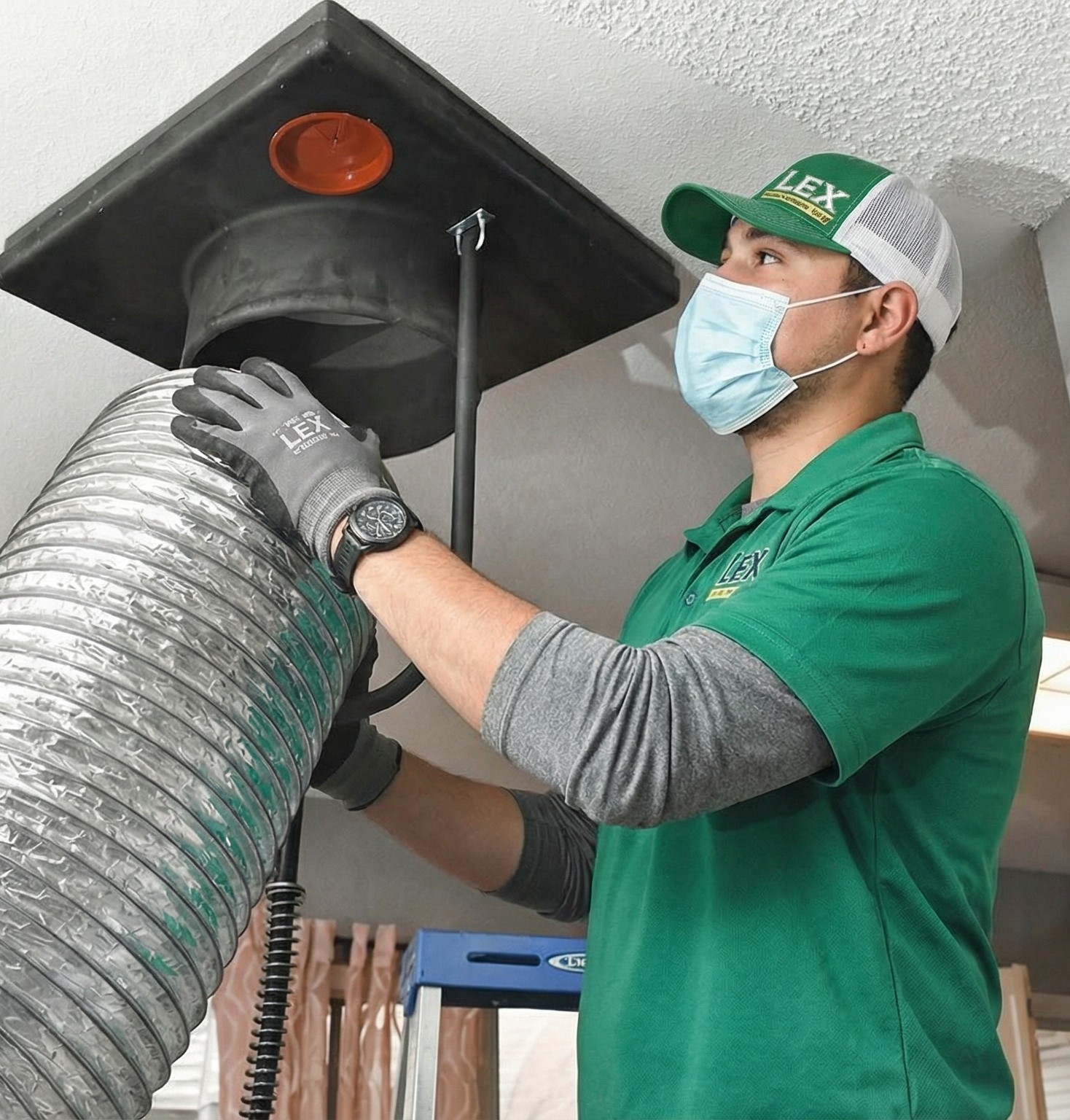 HVAC technician cleaning air ducts